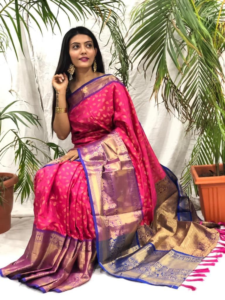 Explore our stunning Dark Pink Soft Kanjivaram Silk Saree , crafted from Premium Soft Kanjivaram Silk  fabric for a luxurious feel. Perfect for weddings, parties, and special occasions, this saree offers unmatched elegance, vibrant color, and a soft, smooth drape.