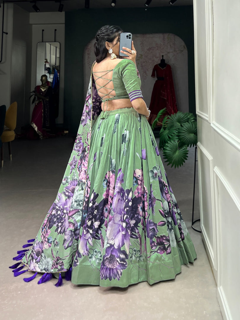 Dark pista Tussar silk lehenga with floral lace details , Beautiful pista green floral lehenga with tassel and can-can finish , Elegant dark pista lehenga with heavy tassels and zari lace , Pista colored Tussar lehenga with gotta patti dupatta, Designer pista lehenga for wedding and engagement looks , Floral print pista lehenga with unstitched blouse fabric . 