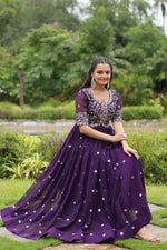 Load image into Gallery viewer, Elegant dark purple gown with zari and sequin embroidery , Faux blooming gown in rich dark purple tone , Party wear dark purple gown with round neck , Dark purple ethnic gown with half sleeves , Wedding-ready purple gown with 3.5 mtr flair . 
