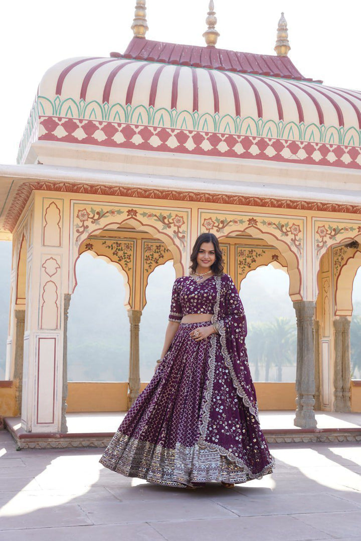 Royal Wine lehenga in viscose jacquard with embroidered sequins , Elegant Wine colored lehenga with faux blooming dupatta , Shop premium Wine lehenga for weddings and parties , Wine lehenga with cotton inner and luxurious finish - Shop Now at Shoppers Trend.