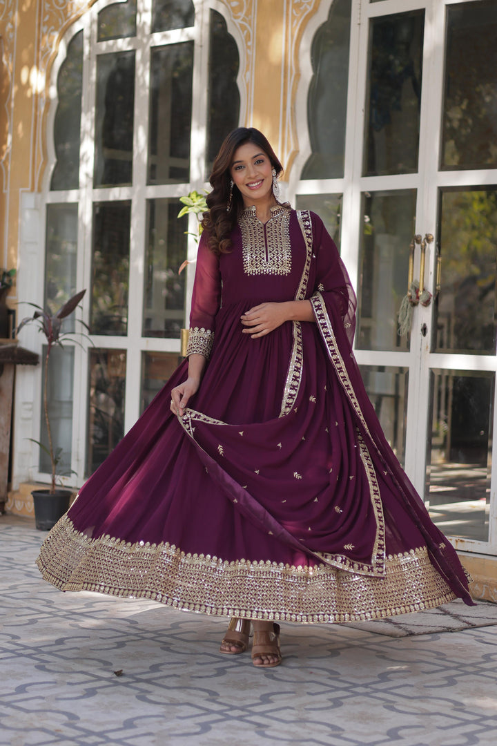 Dark Rani Color With Embroidery Flux Blooming Georgette Gown With Price and Online Shopping Price Under 2000 . Step into style with this Dark Rani Gown in Faux Blooming Georgette. Featuring heavy sequins embroidery, a stitched can-can design, and a Faux Blooming Georgette With Attractive lace and embroidered work, it’s ideal for weddings and celebrations . 
