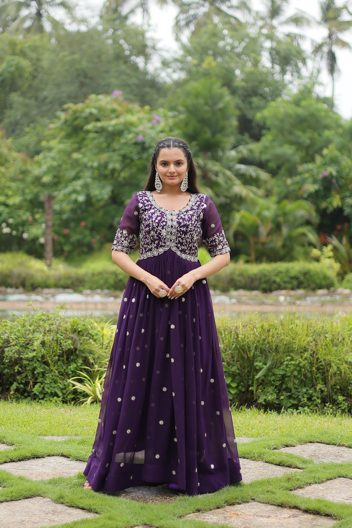Dark Rani Faux Blooming  Gown With Price and Online Shopping Price Under 1500 . This Fabric So Heavy And Embroidery Work Experience elegance with this Faux Blooming Gown. Complete with exquisite embroidery, short cutwork sleeves, and full cotton lining, it’s a timeless piece for festive or formal occasions . 