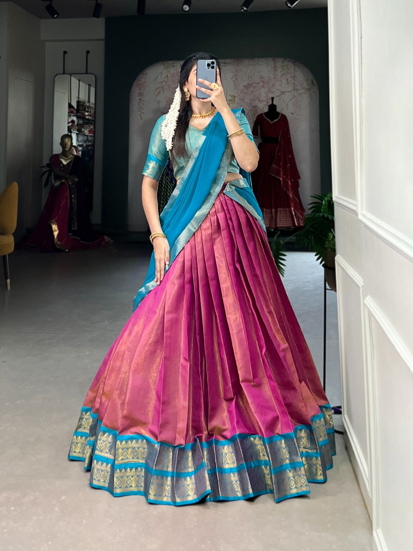 Luxurious Kanchipuram Davani Set with zari-woven stitched lehenga unstitched Kanchipuram blouse material, and elegant lace-bordered georgette dupatta. Classic three-piece ensemble for traditional occasions.
