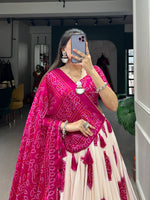 Load image into Gallery viewer, Dark pink Bandhej print lehenga in vibrant tussar silk , Stylish dark pink lehenga with traditional lace dupatta , Designer dark pink lehenga choli with canvas and can-can , Dark pink silk lehenga for weddings and festive celebrations . 
