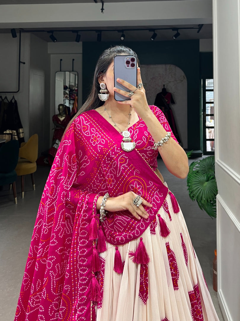 Dark pink Bandhej print lehenga in vibrant tussar silk , Stylish dark pink lehenga with traditional lace dupatta , Designer dark pink lehenga choli with canvas and can-can , Dark pink silk lehenga for weddings and festive celebrations . 