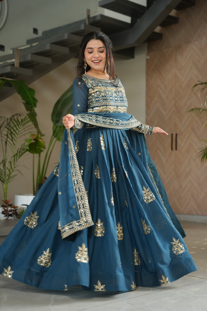 Dark Sky Pure Chinnon Anarkali price , Dark sky chinnon gown with multi-sequins embroidery , Elegant dark sky gown for parties and weddings , Unique dark sky blue gown with beads and thread work , 
Soft chinnon embroidered gown in dark sky tone .