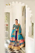 Load image into Gallery viewer, Dark Sky With Dark Rani  Dola Silk Langa Voni , Dhavni Set , Half-Saree and Davani Set With Price and online Shopping Price Under 1500 . This Fabric Dola Silk Red Color For Weddings Collcetion.  Celebrate tradition with this Dola Silk Kalamkari Lehenga Set available in stunning hues of Dark-sky . Comes with a printed blouse and weaving border dupatta for a complete ethnic look . Traditional Look For 2024-25 . 
