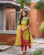Load image into Gallery viewer, Dark Yellow Pure Kanchi Cotton Kurti With Price and Online Shopping Price Under 1500 . Upgrade your wardrobe with this stylish Pure Kanchi Cotton  Kurti Set. Featuring soft fabric, Jcard Weaving , it includes a kurti, dupatta, and pant for a complete elegant look.
