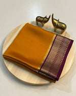 Load image into Gallery viewer, Dark Yellow Semi-Mysore Silk Saree featuring zari weaving. 6.3m length with matching blouse piece. Machine washable. Ideal for Pongal celebrations.

