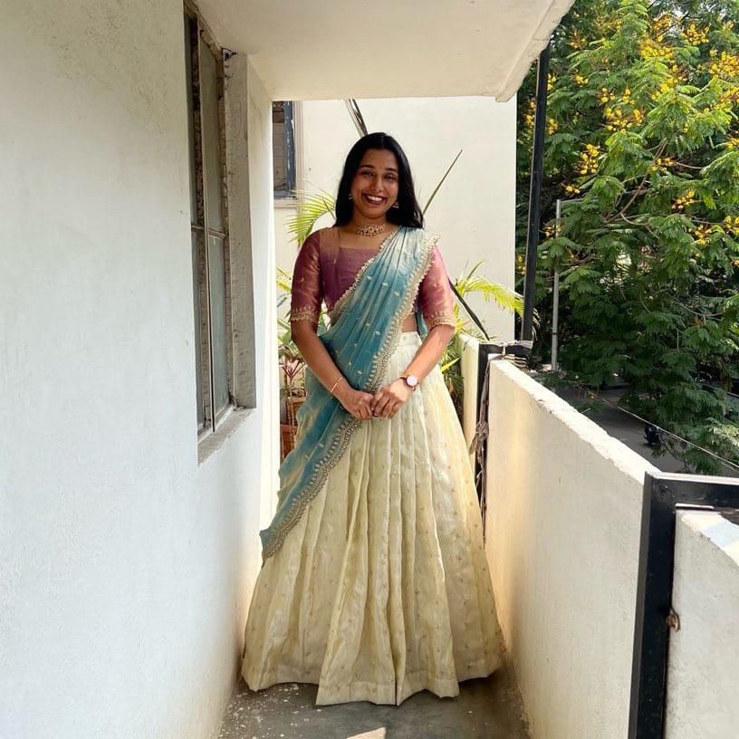 Wine color South Indian tissue silk lehenga , Traditional wine zari lehenga with dupatta , Wine tissue silk half saree for wedding , Embroidered wine lehenga choli with voni , Wine color gold zari lehenga for bridesmaids , Elegant wine color tissue half saree set . 