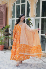 Load image into Gallery viewer, Yellow Pure cotton Anarkali set featuring 52-inch top with half lining, full sleeves and V-neck. Includes 40-inch elastic-waist bottom and 2 meter dupatta.
