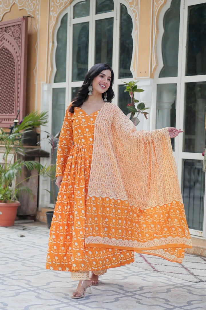 Yellow Pure cotton Anarkali set featuring 52-inch top with half lining, full sleeves and V-neck. Includes 40-inch elastic-waist bottom and 2 meter dupatta.