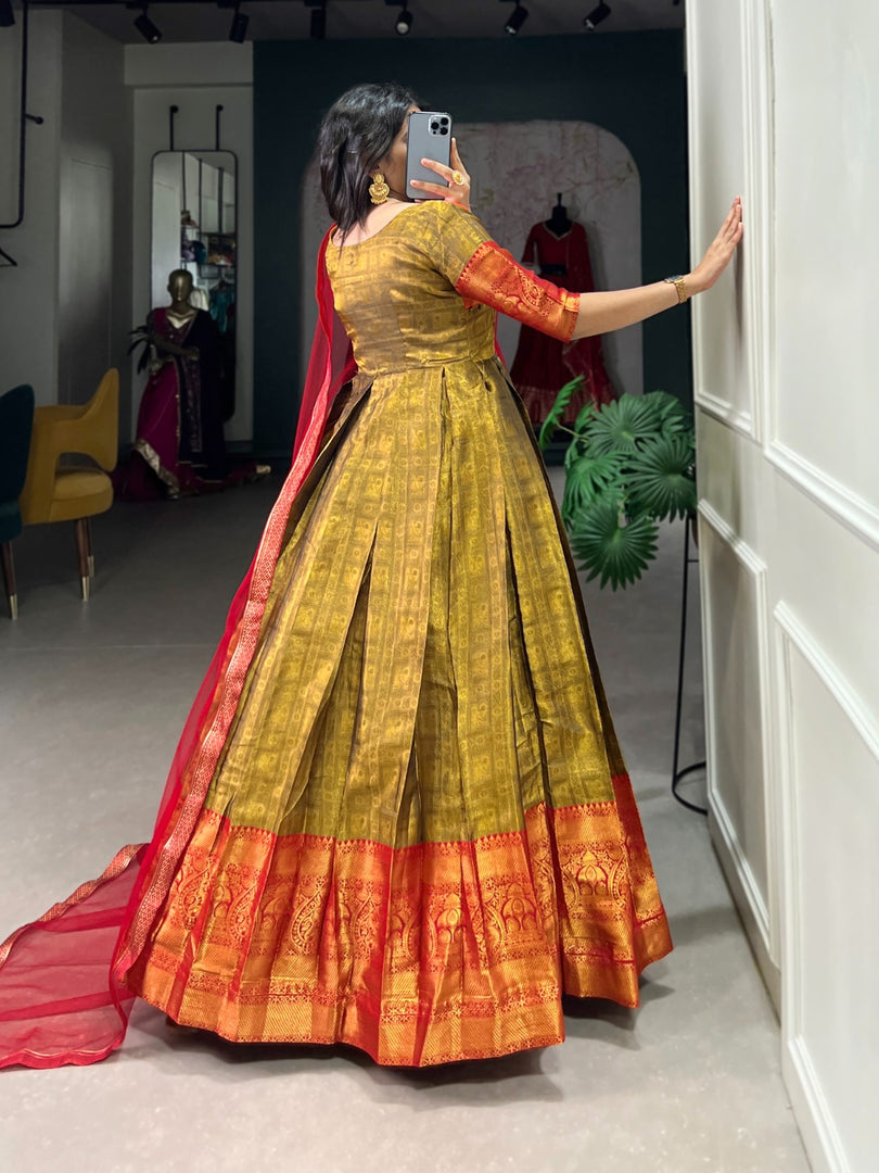 Gold Heavy Kanjivaram with Zari Weaving Work Anarkali , Traditional gold Kanjivaram gown with zari weaving , Elegant gold gown with net dupatta and lace border , Gold silk gown for festive and wedding occasions , Kanjivaram zari gold gown with luxurious flair . 