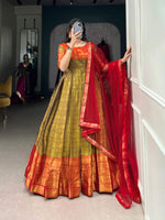 Load image into Gallery viewer, Gold gown for reception or festive functions , Gold designer Kanjivaram gown with soft net dupatta , Gold bridal gown with heavy flair and shine , Subtle yet stunning gold Kanjivaram ethnic gown , Stylish stitched gold gown with extra margin fitting . 
