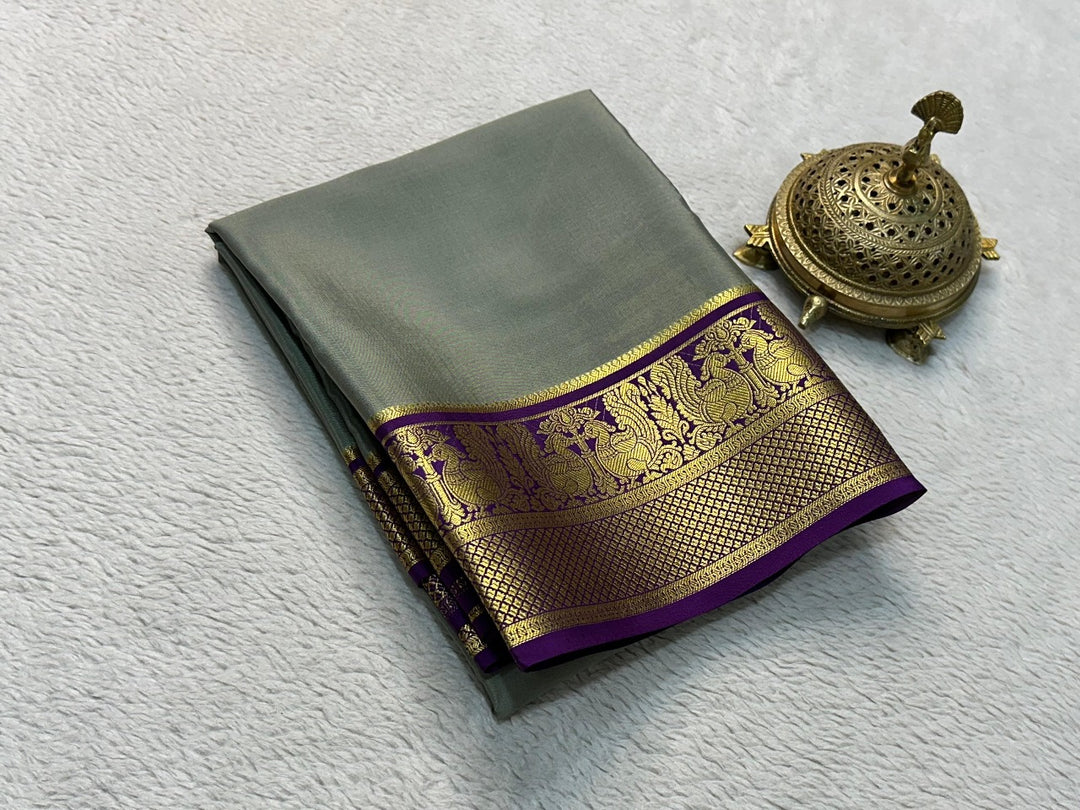 Gray Color Semi-Mysore Silk Saree with traditional Zari weaving. 6.3m length, machine washable. Includes matching blouse. Ideal Pongal attire.