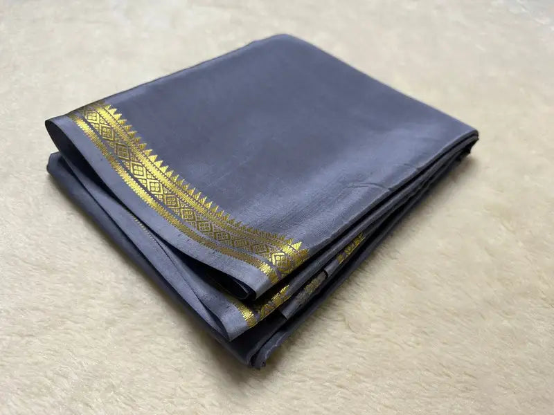Elegant gray silk saree with golden zari border , Partywear gray georgette saree with sequins embroidery , Light gray cotton saree with minimalistic print , Designer gray net saree with heavy work blouse , Stylish gray satin saree with lace border , Traditional gray Banarasi saree for festive occasions , Graceful gray chiffon saree with floral print , Soft gray linen saree with silver weaving work , Modern gray organza saree with digital print ...