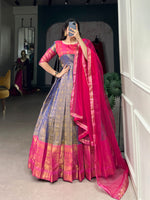 Load image into Gallery viewer, Elegant gray Kanjivaram gown with zari weaving , Gray silk ethnic gown with net dupatta , Zari woven gray gown with lace border detail , Stylish gray gown for festive or evening wear , Gray color traditional gown with soft lining , Silver gray ethnic gown with Kanjivaram look , Stitched gray gown for weddings and events .
