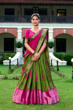 Load image into Gallery viewer, Fresh Green Shibori Print Lehenga in Dola Silk ,Traditional Green lehenga with zari weaving border , Elegant Green Bandhej blouse with printed lehenga , Buy Green Lehenga for festive and party occasions , Green silk lehenga with tassels and foil print . 
