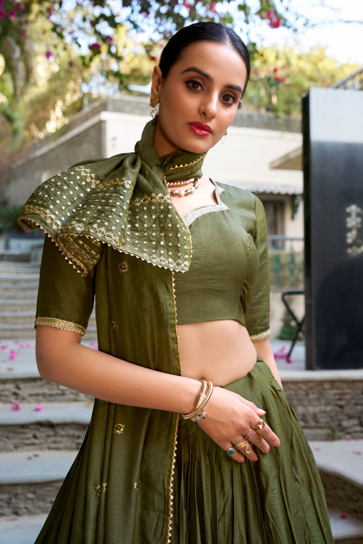 Green Color Pure Chanderi Dhavani Set , Langa Voni , Half-Saree and Davani Set Price and Online Shopping Price Under 1999 . Dark Green Chanderi Lehenga with Rich Embroidery , Bridal Dark Green Lehenga Set with Zari Border , Elegant Green Zari Weaving Lehenga Online , Dark Green Lehenga for Mehendi Function , Traditional Chanderi Lehenga in Deep Green . 