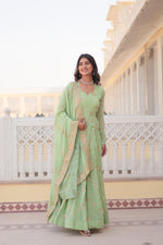 Load image into Gallery viewer, Light Pista Faux Georgette Anarkali with Zari &amp; Sequins Embroidery With price and Online Shopping Price Under 2000 . this Fabric Stunning 56-inch faux georgette gown with zari and sequins embroidery, full sleeves, and a fancy V-neck. Includes a 2.3-meter dupatta with embroidered lace border.
