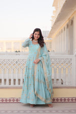 Load image into Gallery viewer, Light Sky Faux Georgette Anarkali WIth Zari Sequins Work With Price and Online Shopping Price Under 2000 . Experience style and comfort with this faux georgette gown. Features zari and sequins embroidery, full sleeves, and a cotton lining. Includes a dupatta with lace border.
