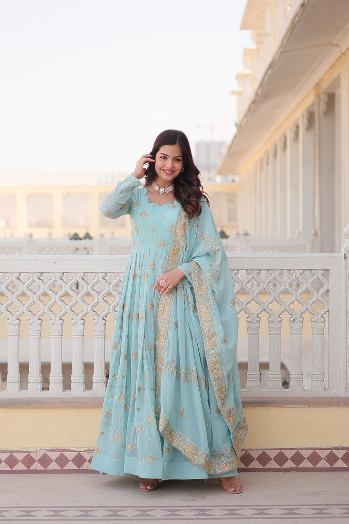 Light Sky Faux Georgette Anarkali WIth Zari Sequins Work With Price and Online Shopping Price Under 2000 . Experience style and comfort with this faux georgette gown. Features zari and sequins embroidery, full sleeves, and a cotton lining. Includes a dupatta with lace border.