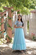 Load image into Gallery viewer, Light Sky Faux Georgette Gowns With Price and Online Shopping Price Under 1500 . this Fabric So Heavy and Smooth Fabric and Working For Sequins Multithreaded Embroidered work , this Fabric Top Side Fully Embroidery Work , This Fabric Light Sky Faux Georgette Gown Best For Weddings Wear Collection , Traditional Look For 2024-25 , 2025-26 . 
