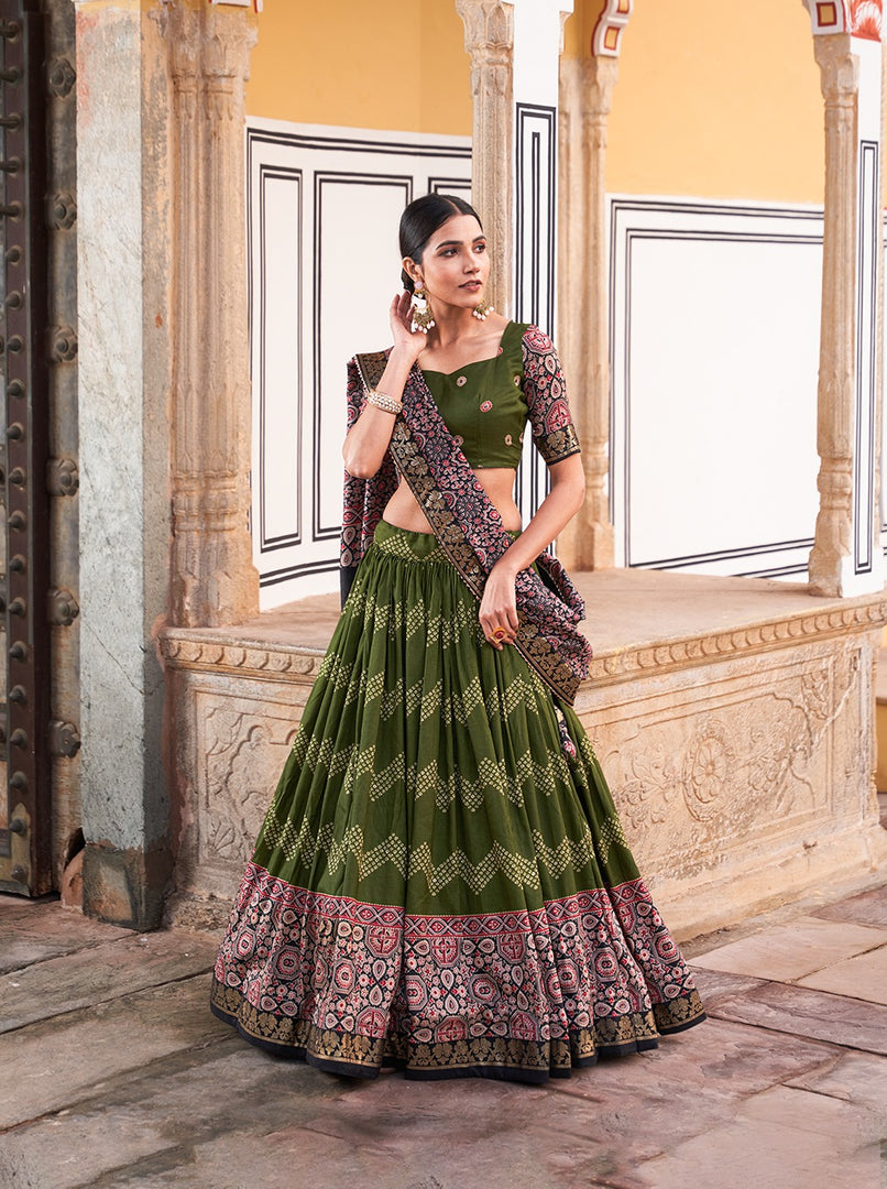 Mehndi Tussar Silk Dhavani Set , Langa Voni  , Half-Saree With Price and Online Shopping Price Under Rs.2500 .  Step into timeless style with this Tussar Silk Lehenga Set. Featuring Ajarakh prints, foil detailing, and a tassel-finished dupatta, it's an ideal outfit for weddings and cultural celebrations