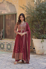Load image into Gallery viewer, Elevate your ethnic style with our stunning Faux Georgette Suit Set, designed for elegance and comfort. Featuring intricate embroidery work, a stylish V-neck top, and a beautifully embroidered dupatta with sequins lace, this outfit is ideal for festive occasions, parties, and special gatherings.
