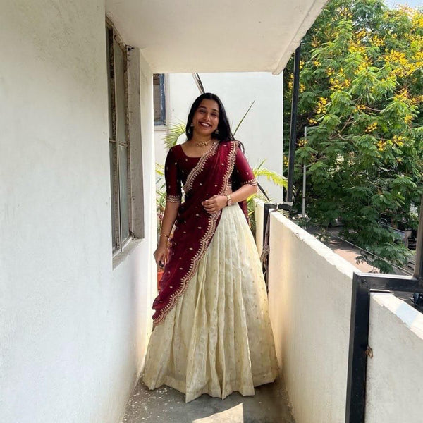 Wine tissue silk half saree lehenga online , South Indian wine color lehenga choli , Wine gold zari lehenga with dupatta , Stunning wine tissue silk half saree , Wine half saree for weddings and festivals , Wine lehenga with embroidery blouse , South Indian traditional wine lehenga , Elegant wine half saree design 2025 , Buy wine lehenga choli with glass tissue blouse , Wine tissue silk lehenga for special occasions .
