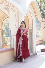 Load image into Gallery viewer, Maroon Faux Blooming Gown With Jacquard Sequins &amp; Cut-Work Dupatta Anarkali WIth Price Under 2000 . this Fabric Sophisticated faux blooming gown with viscose dyable jacquard fabric, full sleeves, and frill stitching. Complete with a cut-work dupatta for festive elegance .
