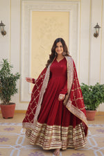 Load image into Gallery viewer, Maroon Faux Blooming Anarkali WIth Price and Online Shopping Price Under 2500 .  Elevate your wardrobe with this 56-inch full-sleeve gown in Faux Blooming. Includes cotton lining and a matching dupatta with sequins embroidered lace.
