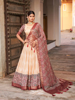 Load image into Gallery viewer, Maroon Tussar Silk Dhavani Set , Langa Voni  , Half-Saree With Price and Online Shopping Price Under Rs.2500 .  This fabric Soft Tussar Silk Dhavani Soft Celebrate traditions in this Tussar Silk Ajarakh Print Lehenga Set. Includes a stitched lehenga with can-can, a matching blouse, and a beautifully crafted dupatta with tassels...
