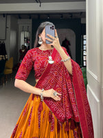 Load image into Gallery viewer, Maroon Bandhej lehenga in traditional tussar silk fabric , Elegant maroon lehenga choli for weddings and festivals , Maroon silk lehenga with bandhej print and lace work , Designer maroon ethnic lehenga with gotta patti dupatta . 
