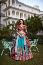 Load image into Gallery viewer, Maroon With Light Blue Color Dola Silk Langa Voni , Davani Set , Half-Saree and Dhavani Sets With Price and Online Shopping Price Under 2000 . Make a statement with this Kalamkari Lehenga crafted in Dola Silk. Includes a flared lehenga, printed blouse, and a zari-bordered dupatta with tassels. Perfect for weddings and festive celebrations . Traditional Look 2024-25 . 
