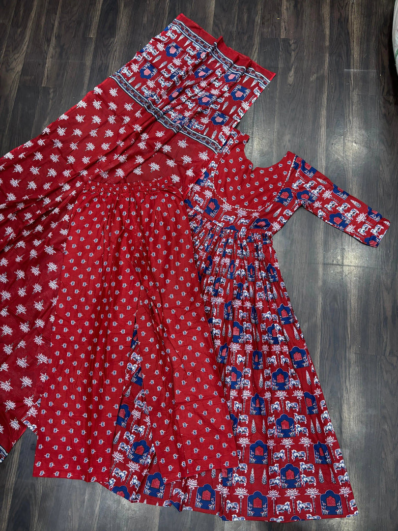 Maroon cotton kurti set with dupatta , Elegant maroon kurti set for women , Pure cotton maroon kurti with pant and dupatta , Maroon kurti set with fancy round , neck , Ethnic maroon kurti pant dupatta combo , Maroon kurti set for festive occasions , Long maroon kurti with elastic pant and dupatta . 