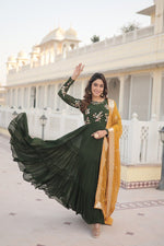 Load image into Gallery viewer, Mahendi faux Georgette Anarkali With Price And Online Shopping Price Under 2000 . This Fabric So Heavy and Shop this elegant 56-inch gown in faux georgette with multi-sequins embroidery, a 12-meter flair, and a 3-layer frill design. Includes a 2.3-meter sequins lace dupatta in Yellow .
