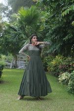 Load image into Gallery viewer, Mehndi Faux Blooming Gown With Price and For Weddings Price Under 1500 . this Fabric So Happy and Cool Fabric . this Fabric Faux Blooming Gown Online Best Shopping Price Under 1500 . this Fabric Best Famous and Best Mehndi Gown Mehndi Color. Mehndi Gown Round Neck Fully Embroidery Zari Sequins Work . Traditional Look For 2024-25 . 
