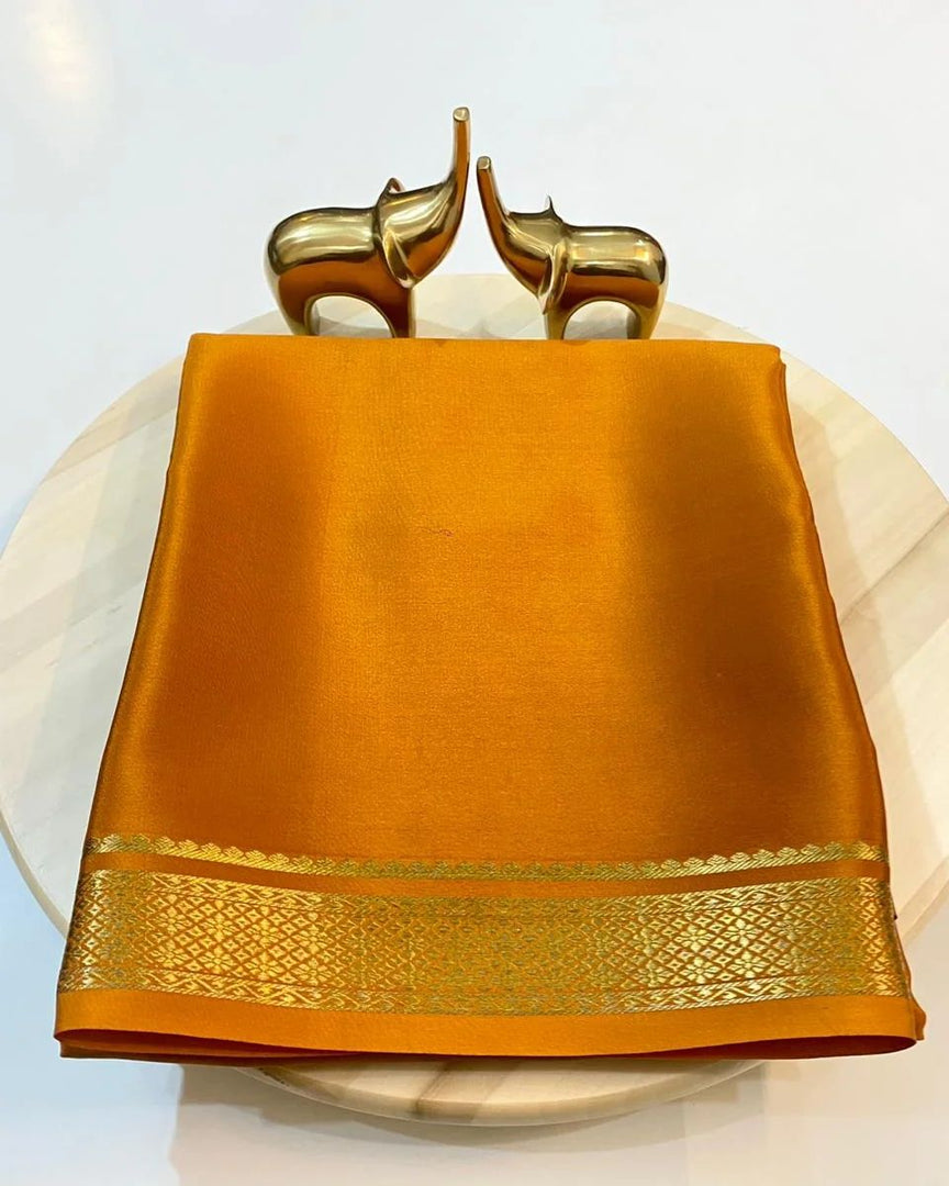 Hemali Semi-Mysore Silk Saree exemplifies traditional Indian craftsmanship with its meticulous zari weaving technique. Crafted from premium Semi-Mysore Silk, this saree offers the perfect balance of luxurious sheen and practical wearability.