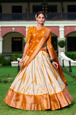 Load image into Gallery viewer, Wedding function lehenga in beautiful Orange shade , Stylish Shibori Print Orange Lehenga with flair , Orange Dola Silk Lehenga with golden detailing , Shop Orange lehenga for traditional occasions , Elegant Orange bridal lehenga with classic touch . Orange lehenga for sangeet, reception or party wear.
