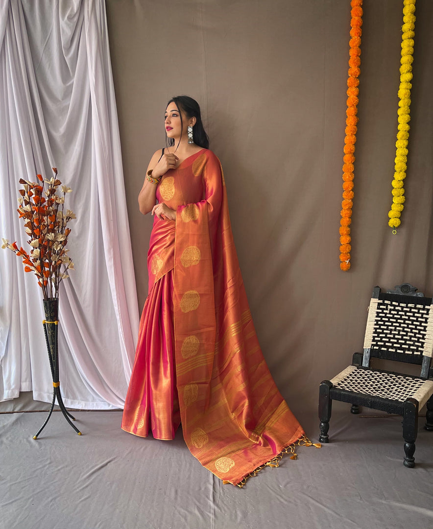 Orange Pure Tissue Silk Sarees, crafted with pure silk and intricate weaving. Shop lightweight, handwoven sarees for weddings and festive occasions.