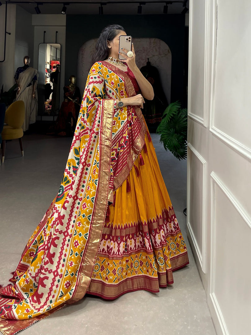 Orange Tussar Silk Dhavani Set , Langa Voni , Half-Saree and Davani Set With Price and Online Shopping Price Under 2000 . This Fabric Soft and Patola Print With foil work . This Fabric Stitched For Stitched With Canvas and attached . This Fabric Tussar Silk Rajavadi Pattern and This famous For Patan in Gujrat  Famous. 