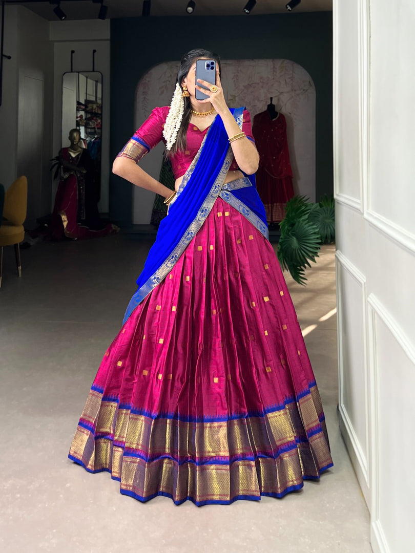 Cotton Silk Half-Saree featuring Paithani weaving work. Includes stitched lehenga ,  unstitched matching blouse, and Georgette dupatta with lace border. Complete traditional ensemble ready to wear.