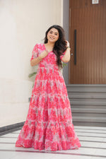Load image into Gallery viewer, Elegant pink gown in printed faux georgette , Pink color gown with beautiful floral design , Floor-length pink gown with full 12-meter flair , Designer pink ethnic gown for festive wear , Soft pink gown with V-neck and half sleeves .
