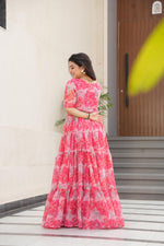 Load image into Gallery viewer, Elevate your with our exquisite Pinal Faux Georgette Gown. Crafted from premium faux georgette fabric adorned with prints work, this gown combines elegance with comfort. The generous 56-inch length and luxurious 12-meter flair create a stunning silhouette that flows gracefully with every movement. Designed with meticulous attention to detail , 
