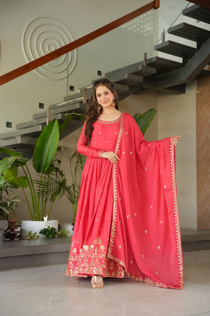 Elegant pink gown with embroidery zari sequins work , Pink chinnon gown with designer lace dupatta , Soft pink ethnic gown for women , Full sleeve pink gown with cotton lining , Stylish pink gown for party and functions , Round neck pink gown with sequin detailing , Wedding wear pink gown with dupatta . 