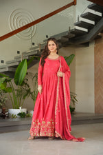 Load image into Gallery viewer, Pink floor-length gown with embroidery work , Chinnon fabric pink gown for festive occasions , Heavy work pink gown with traditional touch , Pink flared gown with 3.5 meter flair , Pink gown for Mehendi and Haldi functions , Light pink sequin gown for reception , Designer pink gown with embroidered dupatta , Fancy pink full sleeve gown for ethnic events .

