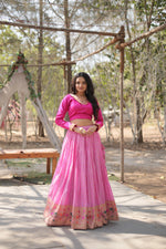 Load image into Gallery viewer, Pink lehenga set with full-stitched ready-to-wear finish , Luxurious pink lehenga for bridesmaids and wedding guests , Classy pink lehenga with traditional Indian aesthetic . 
