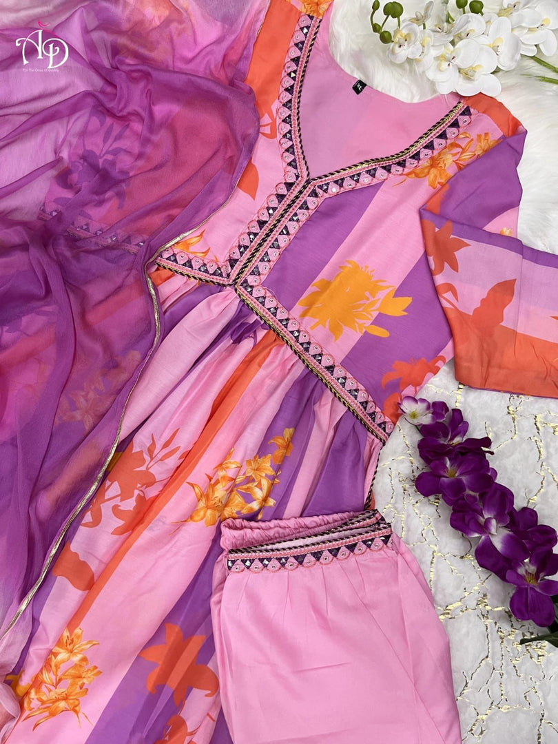 Fatema Muslin Anarkali is crafted from muslin fabric with a digital shine print. It features a V-neck, full sleeves, and measures 52-55 inches in length. The set includes one gown and a dupatta, and is machine washable for convenience.
