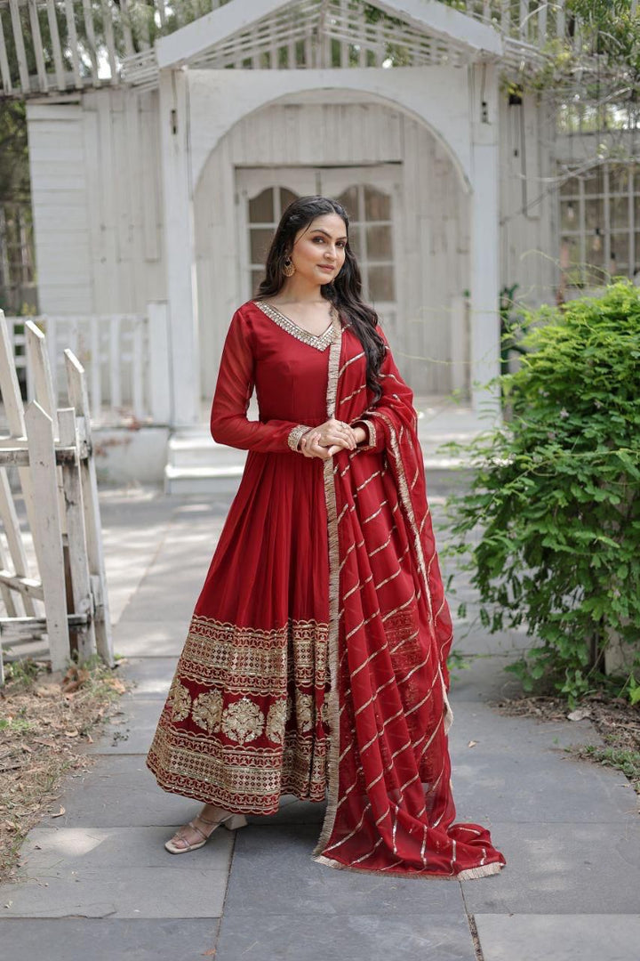 Maroon Faux Blooming Gown With Price and Online Shopping Price Under 2000 . Shine at any event with this Faux Blooming Gown in Maroon. Featuring sequins embroidery, a V-neck, full sleeves, and a matching dupatta with designer lace, it’s elegance redefined.